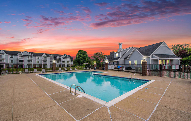 A swimming pool at sunset at The Crossings Apartments, Michigan