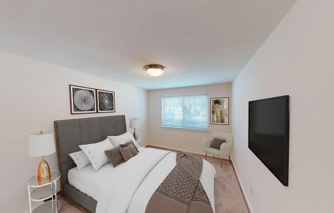 bedroom with bed, nightstands, large windows and tv at cambridge square apartments in bethesda md