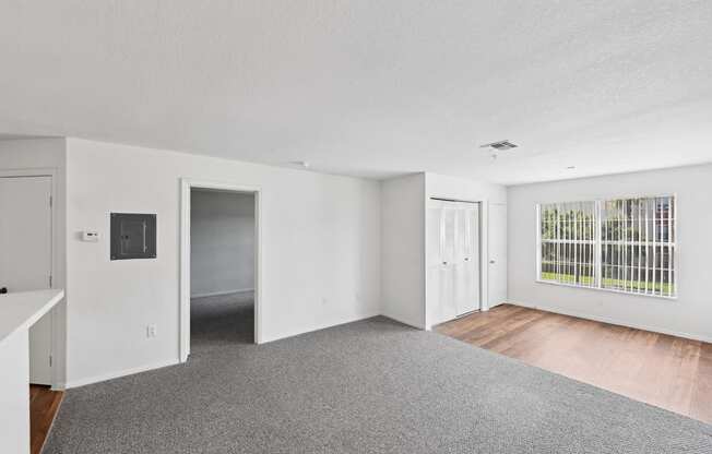 the living room and dining room of an apartment