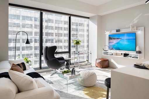 a living room filled with furniture and a large window at 220 Meridian, Indianapolis, IN 46204