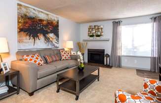 a living room with a couch and a coffee table at Skyview Apartments, Westminster