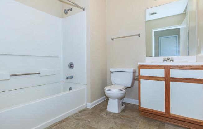 a large white tub sitting next to a window