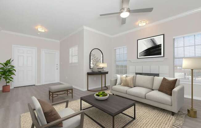 A living room with a white couch, a coffee table, and a potted plant.