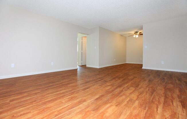 a large empty room with a wood floor