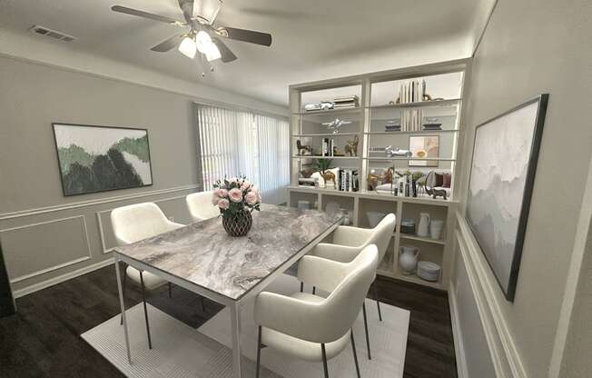 A dining room with a table and chairs.