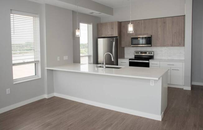 1 bedroom joel kitchen with breakfast bar at Urban Park I and II Apartments, St Louis Park, MN, 55426