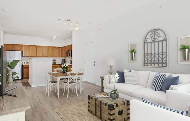 A white living room with a dining table and chairs.