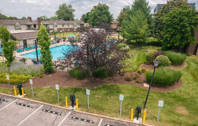 an aerial view of a yard with a swimming pool