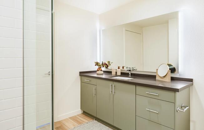 Modern bathrooms feature sleek cabinetry, expansive vanity space, and refined finishes designed for both style and functionality.