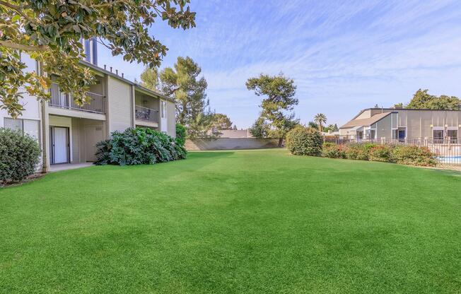 a green lawn in front of a house