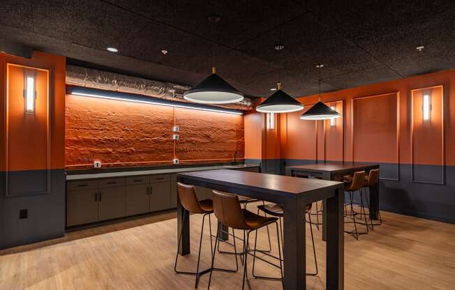 a dining room with a table and chairs and lamps