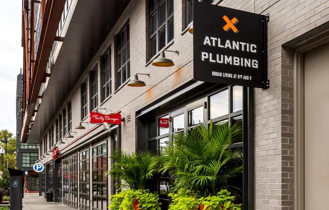 the facade of atlantic plumbing on a city street