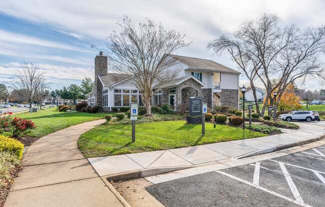 a house with a parking lot in front of it at Misty Ridge Apartments, Woodbridge, VA