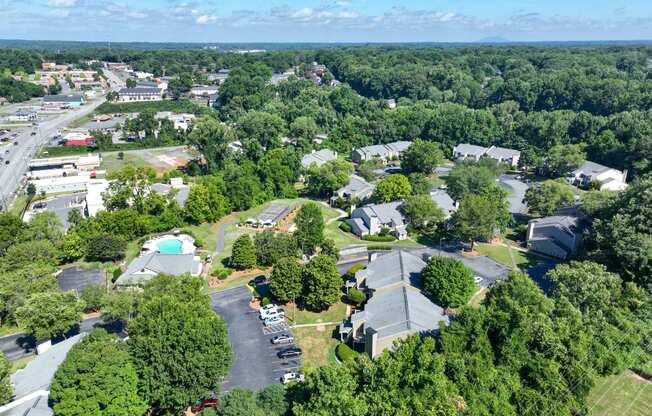 an aerial view of a neighborhood with houses and trees