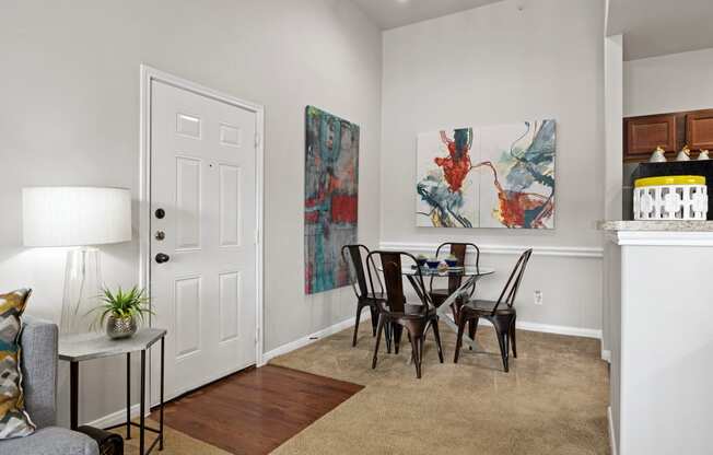 an open living room and dining room with a table and chairs