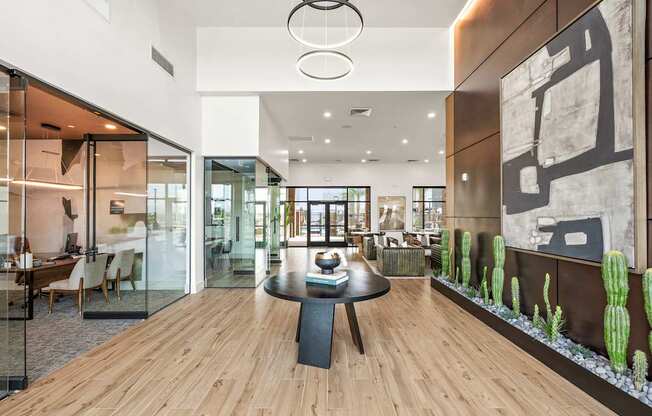 A modern dining room with a glass table and chairs.