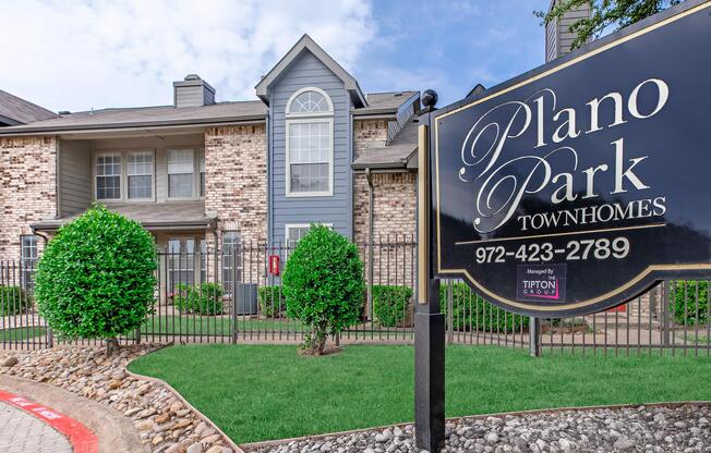 a sign in front of a building