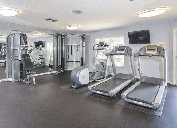 Thumbnail 14 of 19 - Fitness Center With Weight and Cardio Machines