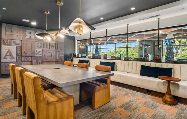 A conference room with a long table and chairs.
