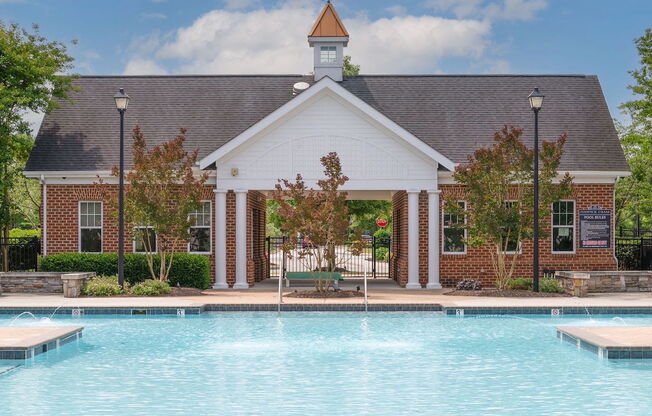 large beautiful pool in front of building at Fenwyck Manor Apartments in Chesapeake, VA