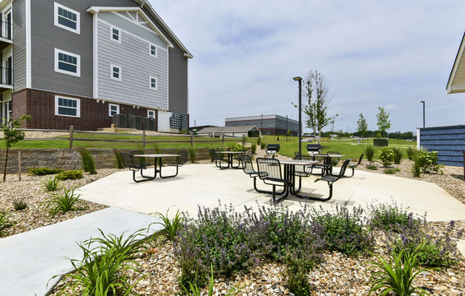 Outdoor Grills With Intimate Seating Area at Dodson Pointe Apartment Homes, Rogers, AR, 72758