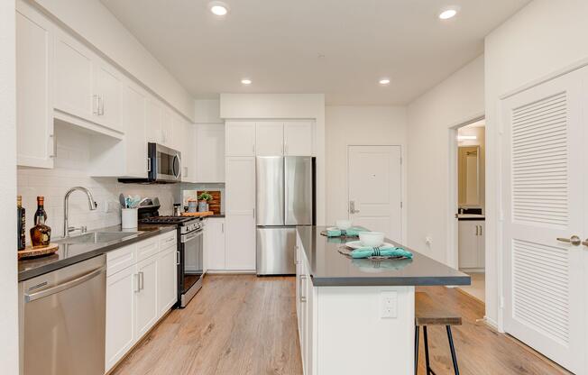 a kitchen with a sink and a refrigerator