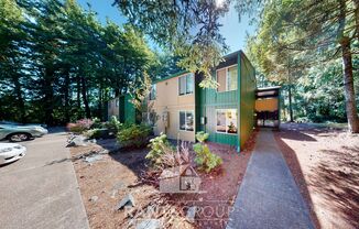 Lovely, wooded 2-bedroom apartment with a large private deck and in-unit washer & dryer!