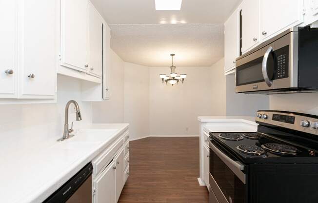 Kitchen with Stainless Steel Appliances and White Cabinets