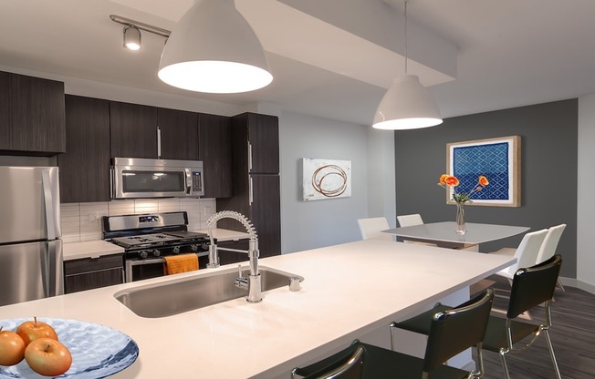Quartz countertops, custom cabinetry and stainless steel appliances in our redesigned homes