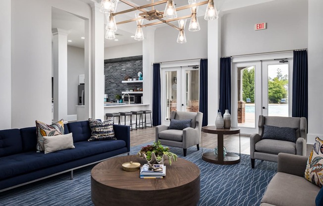 a living room with couches and chairs and a coffee table