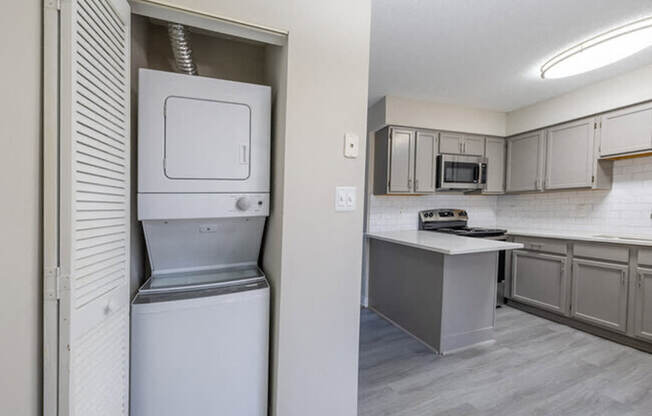 three different views of a kitchen with white cabinets and a counter top