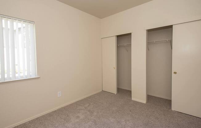 A room with a carpeted floor and a window with blinds at Sunset Summit, Rocklin, CA, 95765