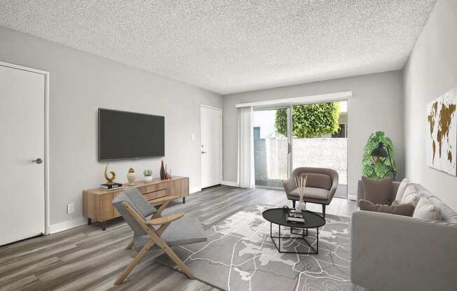 Hardwood floored living room with view of private balcony.