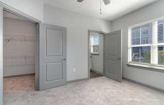Bedroom with two closets and a ceiling fan at The Parker Myrtle Beach, South Carolina, 29588
