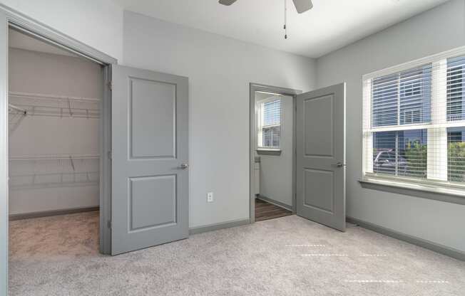 Bedroom with two closets and a ceiling fan at The Parker Myrtle Beach, South Carolina, 29588
