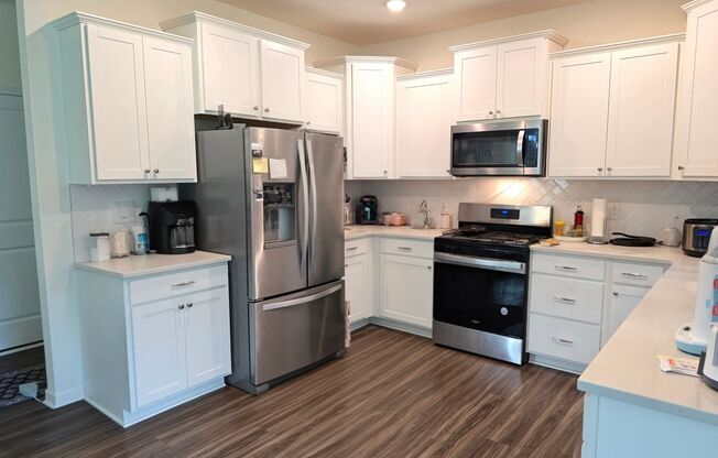 Centrally located, brand new 3-bedroom, 2.5-bathroom w/ Lawncare included