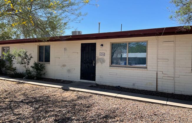 Central 2 bedroom 1 bath unit with Fenced yard.