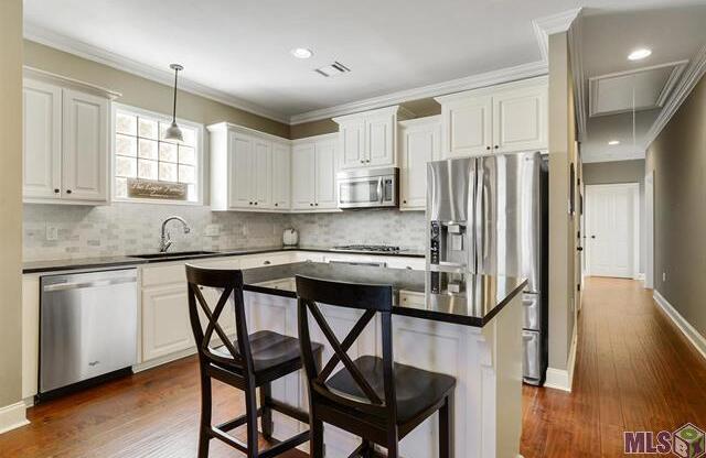 3 Bedroom home in a Gated Community off Perkins Rd. Subdivision has a Community Pool & Fitness Center!