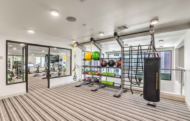 State-of-the-Art Two-Story Fitness Center with Spin/Yoga Room with Wellbeats