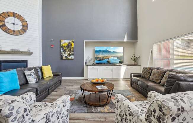A living room with a grey couch and a coffee table.