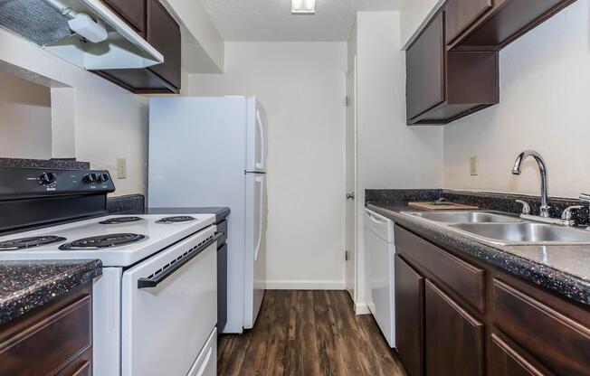 a kitchen with a stove top oven