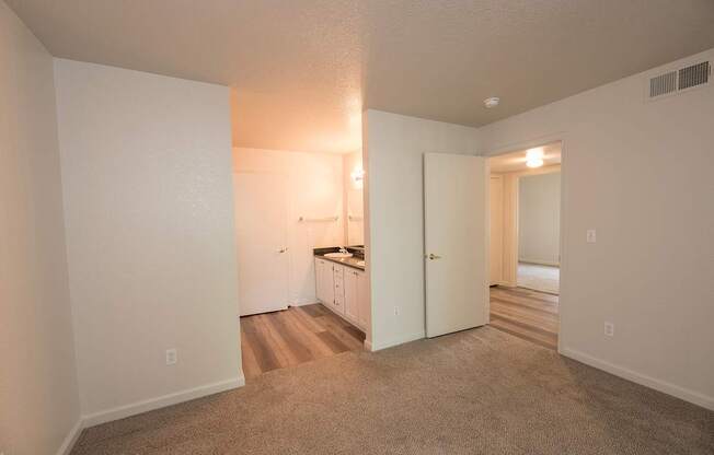 A room with a sink area in the background at Autumn Oaks Apartments, Roseville, CA, 95678