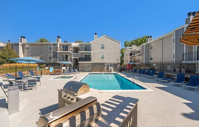 Huntington Apartments pool and BBQ grills and poolside seating