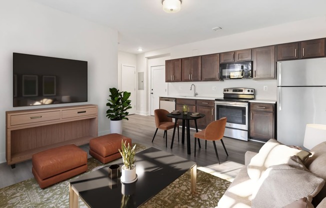 a living room with a couch and a table and a kitchen
