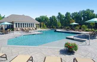 pool with sundeck and umbrellas