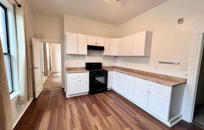 Lovely two bedroom with bonus room, washer/dryer hookups, and parking!