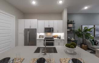 A modern kitchen with a dining table set for four.