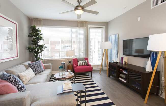 a living room with a couch coffee table and tv