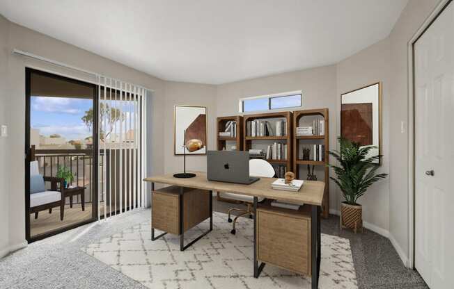 a home office with a laptop on a desk and a door to a balcony