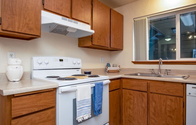 Broadway Center | Kitchen with Wood Cabinetry and Light Filled Window